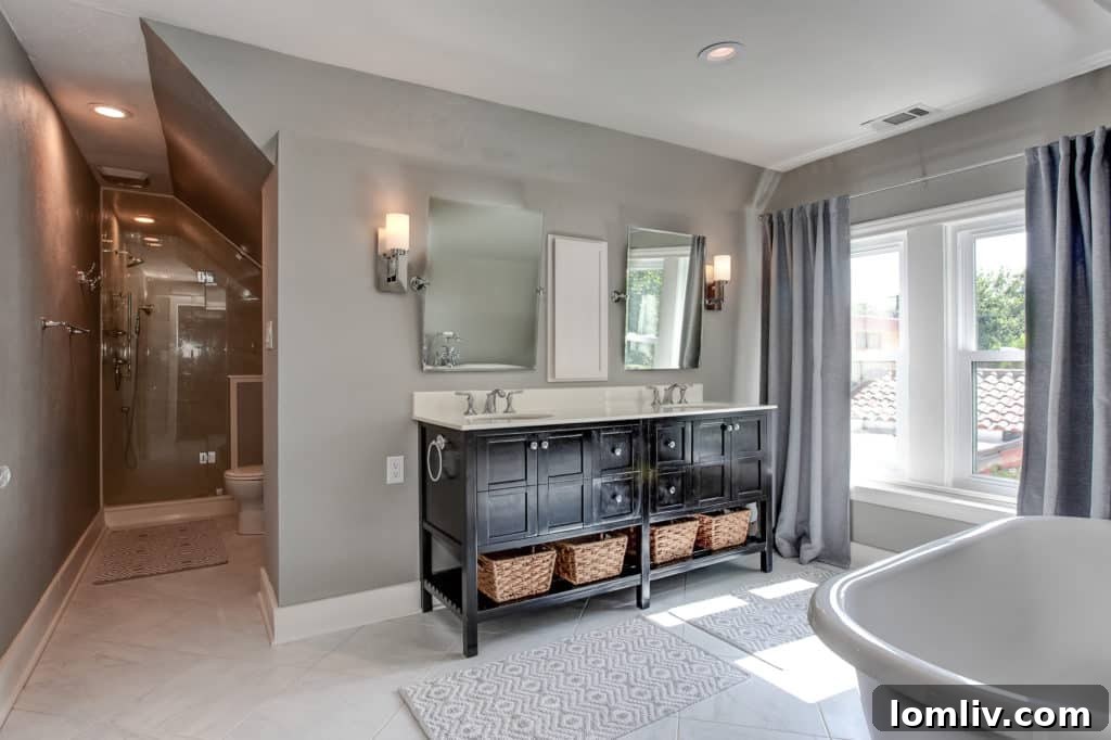 Spacious, bright, and impeccably renovated master bathroom, designed for ultimate relaxation and convenience.