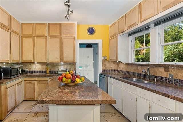Blue sided artistic cottage with green door at 132 South Shore Drive