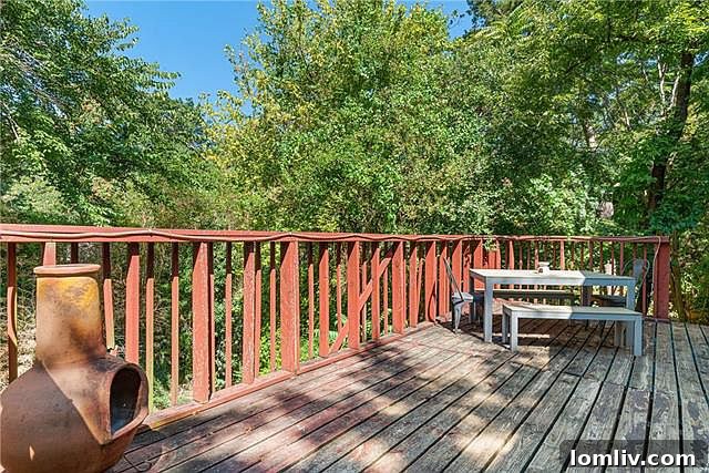 Large outdoor deck overlooking Cedar Creek at 132 South Shore Drive