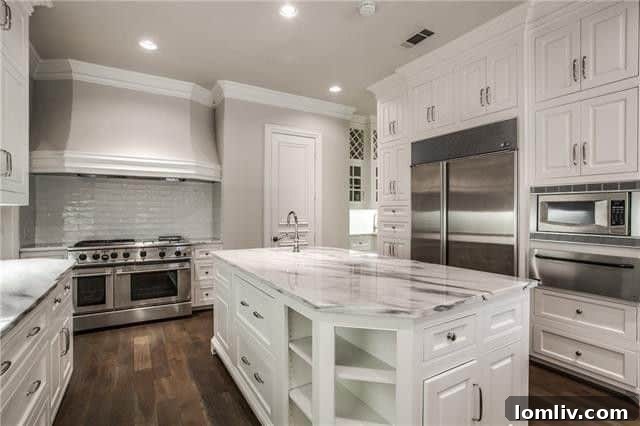 Luxurious master bathroom with freestanding tub, walk-in shower, and marble finishes