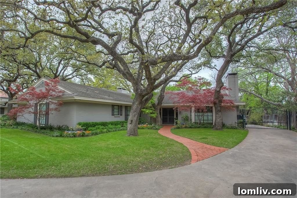 The stately entrance of 309 Ridgewood Road, surrounded by mature trees.