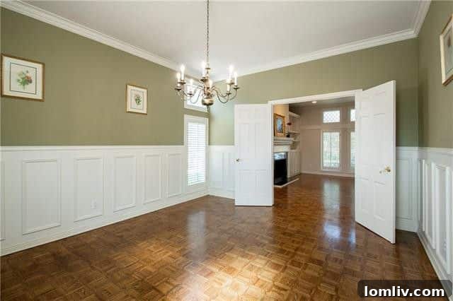 Turnkey Living: A Preston Forest Bargain Steps to Whole Foods 4 Formal dining room with elegant wainscoting, large windows, and ample space for flexible use in a luxury Dallas condo