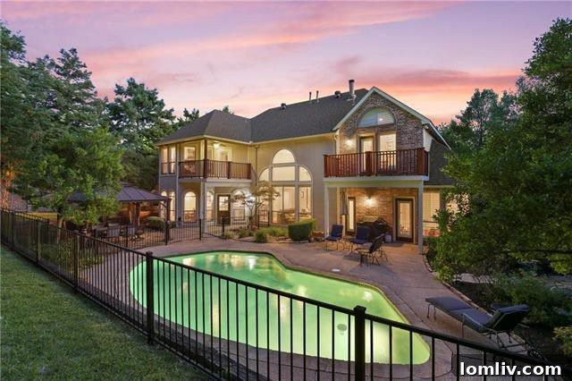 Exterior view of 1203 Waterside Circle, showcasing expansive backyard and lush landscaping