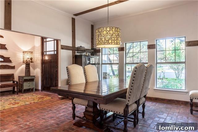 Inviting living area with a custom staircase and brick flooring at 333 Meadowcreek Road