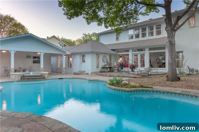 Spacious backyard with a covered patio, pool, and spa at 333 Meadowcreek Road