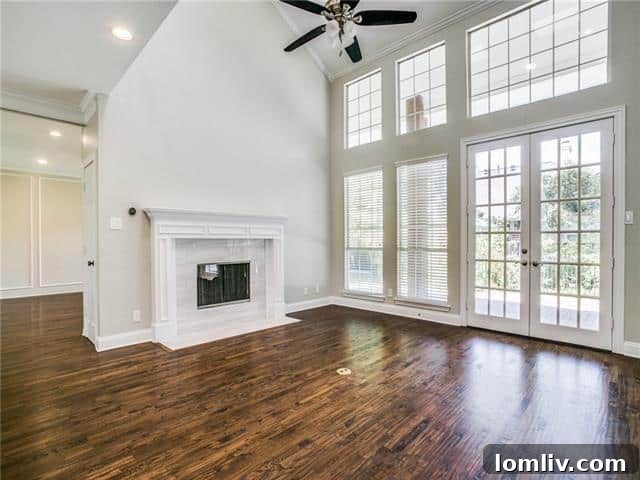 Modern kitchen with black cabinets, granite countertops, and stainless steel appliances at 209 Glendale Drive