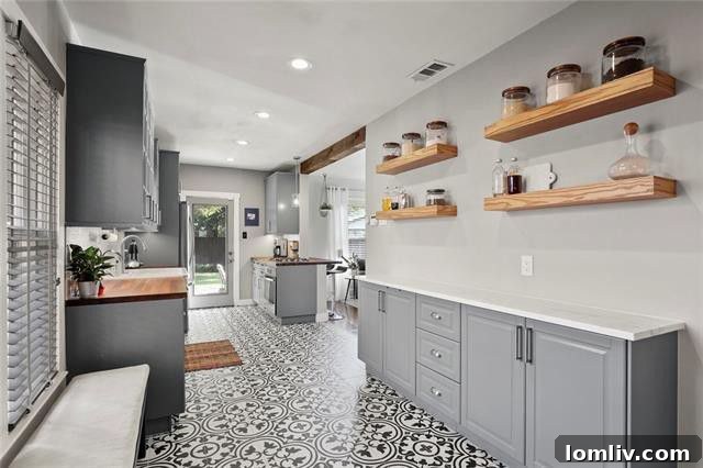 Tastefully updated bathroom with elegant tiling and fixtures, offering a fresh, clean aesthetic.