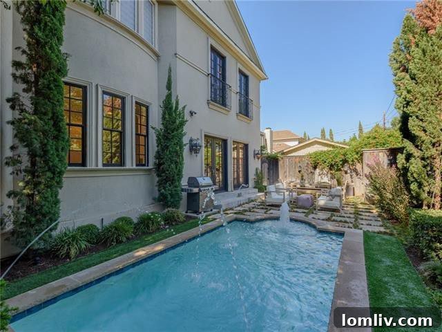 Grand exterior of the Southern Avenue home, featuring lush landscaping and a sparkling pool.