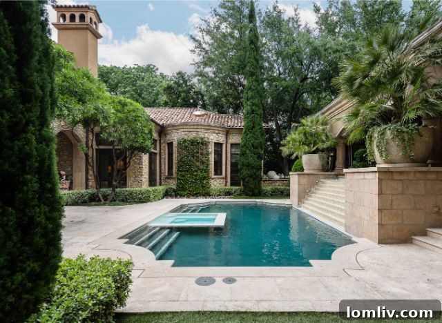 Chic covered outdoor lounge area with fireplace and comfortable seating