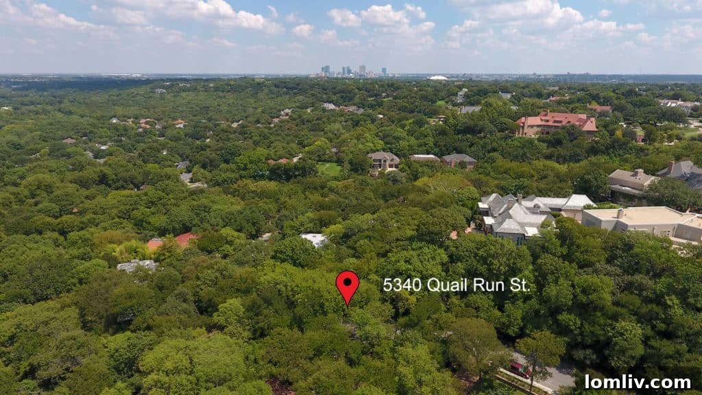 Aerial view of 5340 Quail Run surrounded by lush trees