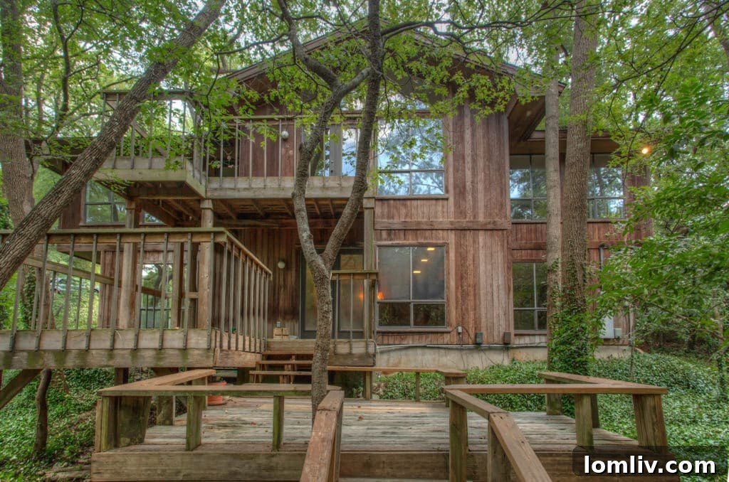 The back of 5340 Quail Run with multiple levels and decks
