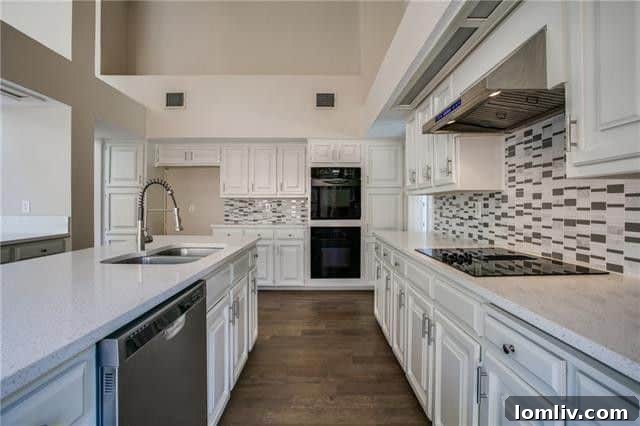 Luxurious Remodeled Kitchen with Quartz Countertops and White Cabinetry