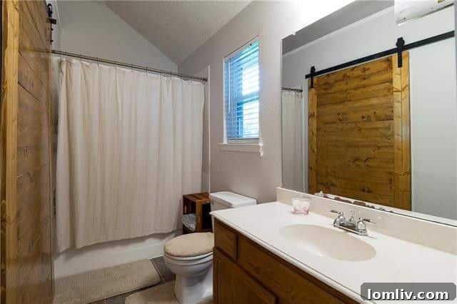 Bathroom or closet with barn door in 1402 Pecan Creek Drive