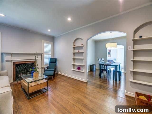 Inviting living space with a traditional fireplace and built-in shelves