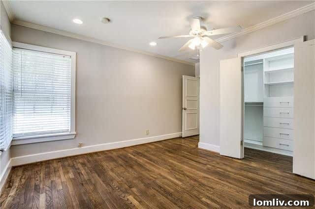 Spacious bedroom with bright windows and hardwood flooring at 5947 Marquita Avenue