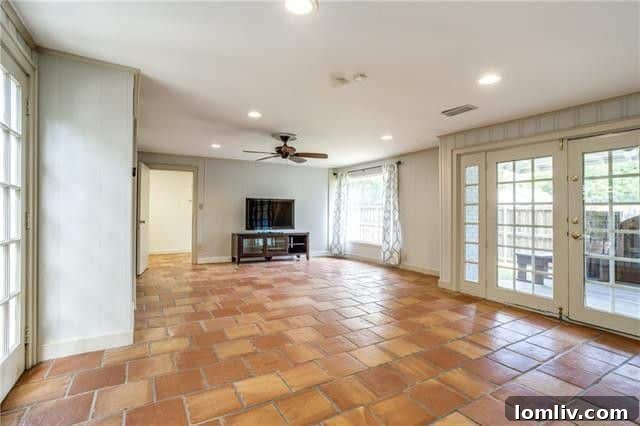 Well-maintained backyard with an electric gate and fencing at a Dallas property