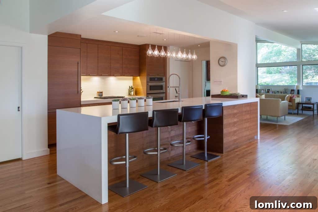 After renovation: A wide-open, contemporary kitchen designed for entertaining and family gatherings.