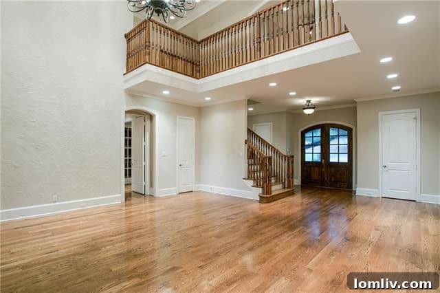 Welcoming Grand Foyer and Staircase at Tangleridge Lane Residence