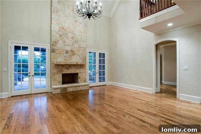 Spacious Living Room with Two-Story Stone Fireplace at 13416 Tangleridge
