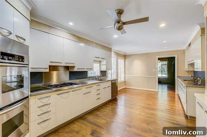 Spacious Kitchen with Vintage St. Charles Cabinets and Modern Appliances