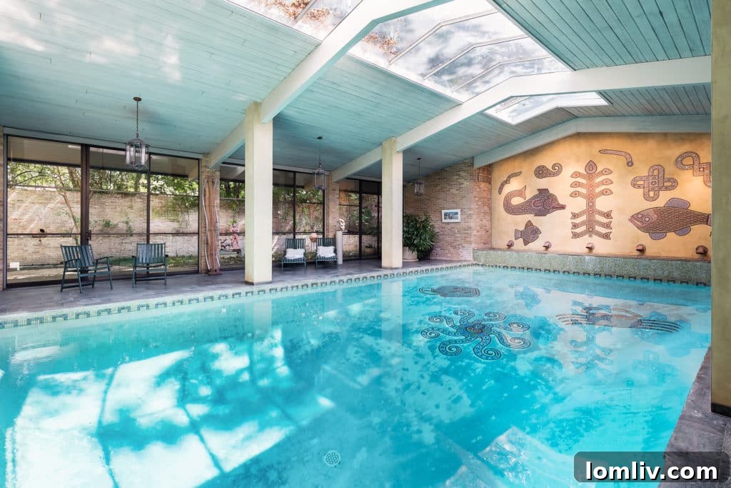 Stunning indoor swimming pool with artistic mosaic by Thomas Stell