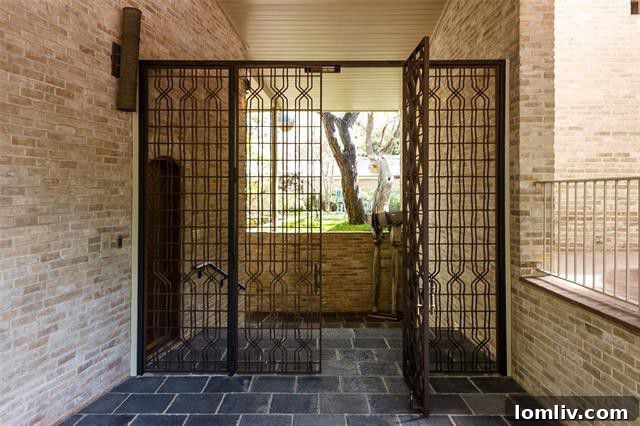 Gated entry leading to the O'Neil Ford designed property