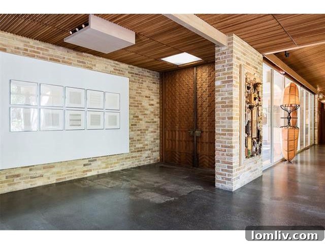 Another view of the sophisticated living space, emphasizing natural light and materials