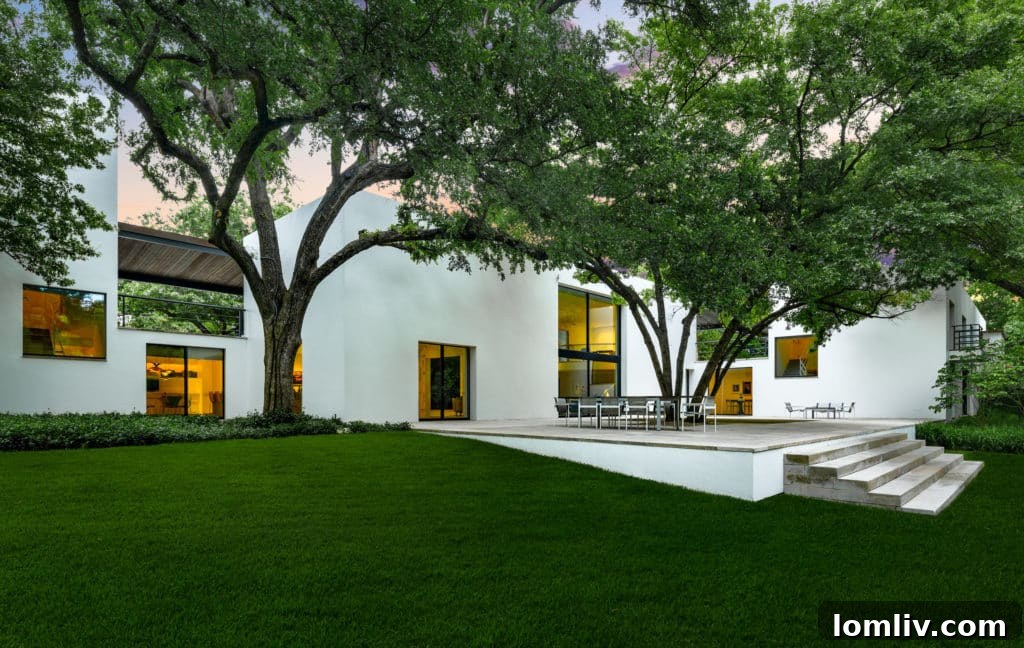 Edward Larrabee Barnes' Signature Modern Estate in Preston Hollow 12 Exterior view of 4608 Meadowood Road with lush landscaping