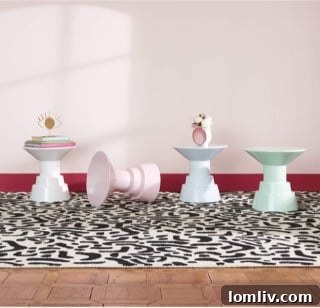 Stylish Otto Pedestal Accent Table in a modern living room setting.