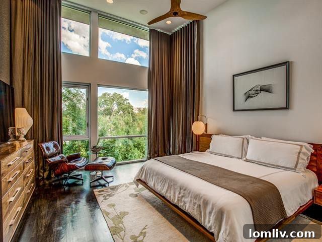 Luxurious master bedroom with expansive floor-to-ceiling windows and contemporary decor