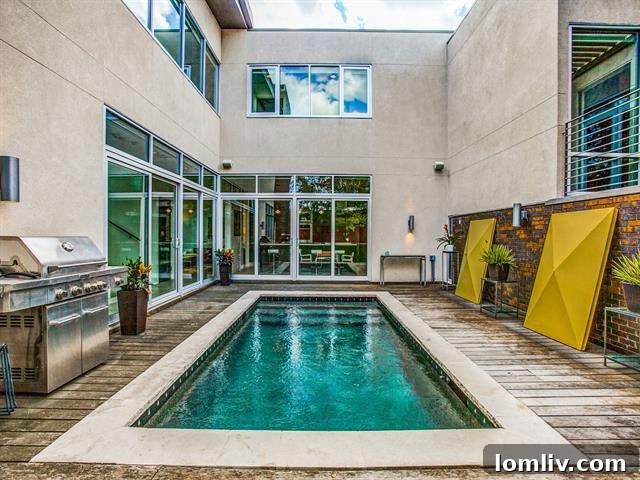 Open-concept living room with floor-to-ceiling glass, offering views of the private courtyard