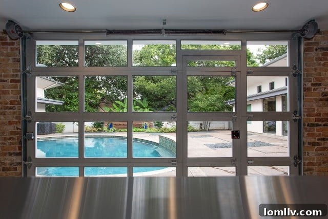 Kitchen featuring a functional garage door providing direct access to the pool area, blending indoor and outdoor living.