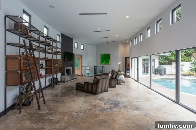 Transformed living room featuring polished concrete floors and an open layout, enhancing spatial volume.