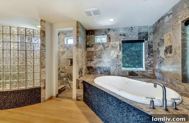 Original master bathroom featuring outdated glass brick, characteristic of 1980s design.