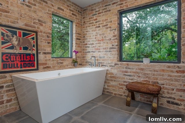 Renovated master bathroom with exposed brick, a key element of the industrial 'warehouse' aesthetic.
