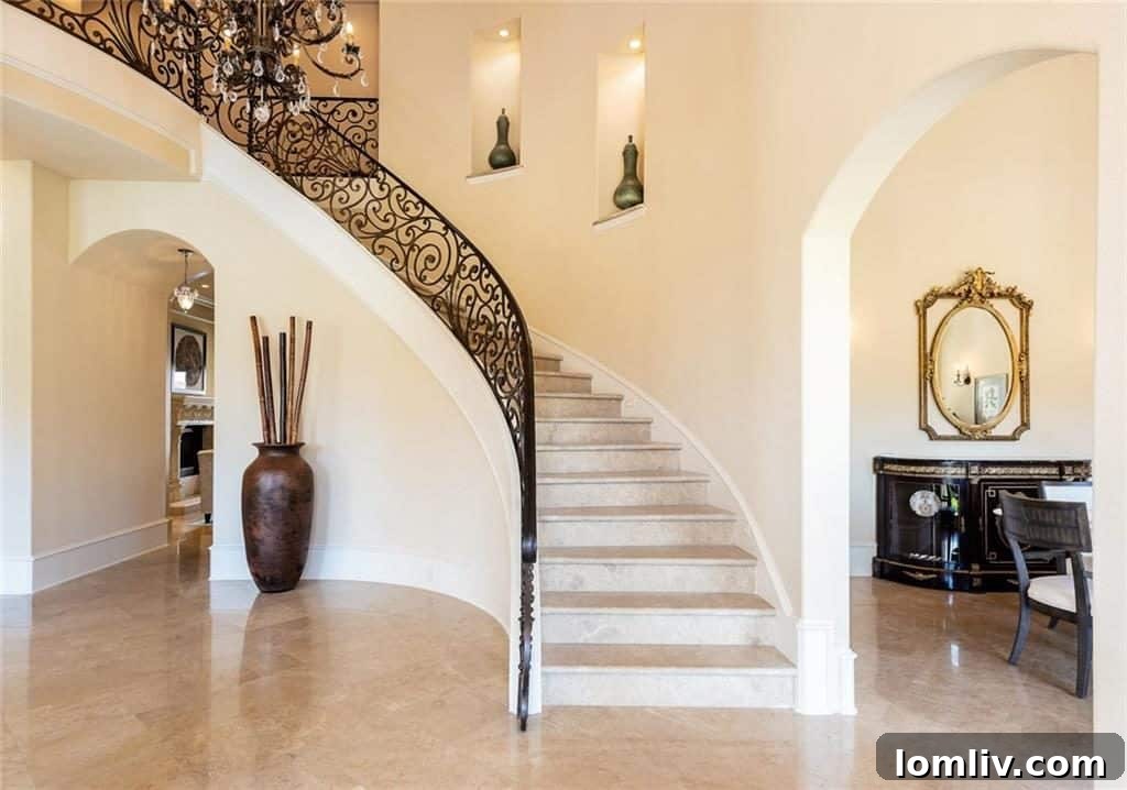 Grand Entrance of a Mediterranean Home Before Modern Updates