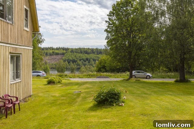 A picturesque view of Lake Mellan-Swan from the property, highlighting the serene Swedish landscape.
