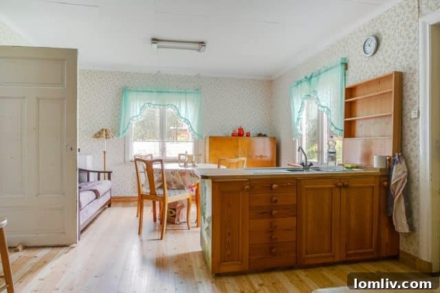 A view of another upstairs bedroom, maintaining the home's charming and authentic Swedish feel.