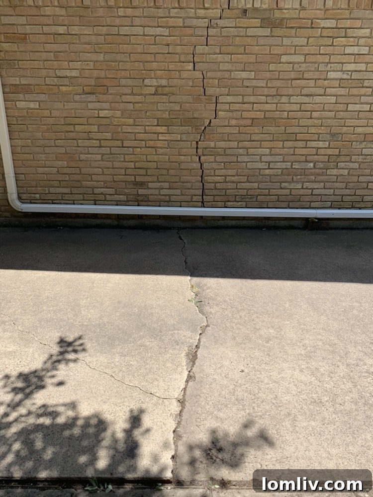 Foundation problems in North Texas often manifest as deflection cracks in brickwork due to soil movement.