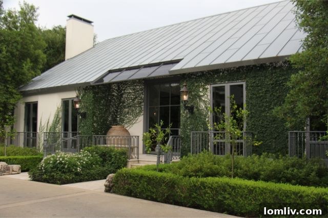 Contemporary home exterior with standing-seam roof at 4241 Westway Avenue