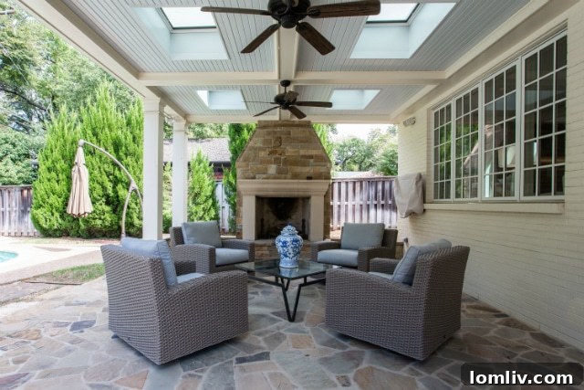 Lush backyard with inviting swimming pool and spacious patio areas, perfect for outdoor entertaining and relaxation