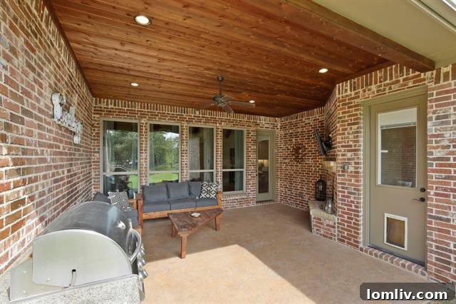 Argyle-Caliber Home Covered Patio with Fireplace