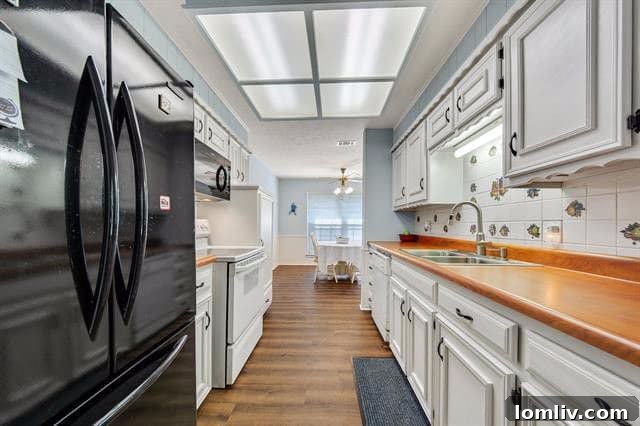 Modern Galley Kitchen with White Cabinets