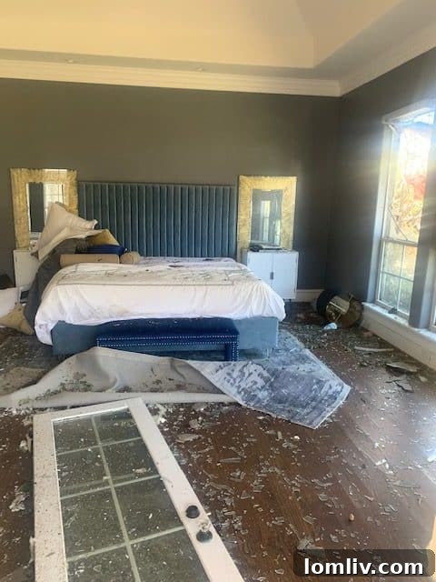 A damaged staircase inside Tyler Seguin's mansion, amidst debris and structural devastation from the North Dallas tornado.