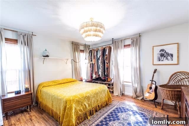 Chic Master Bedroom with Tasseled Chandelier and Swing Lights