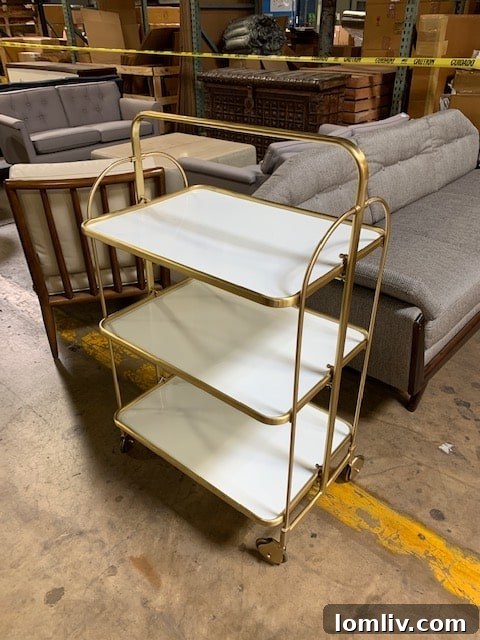 Global Views sale inventory: Ornate console table with decorative vases and lamps