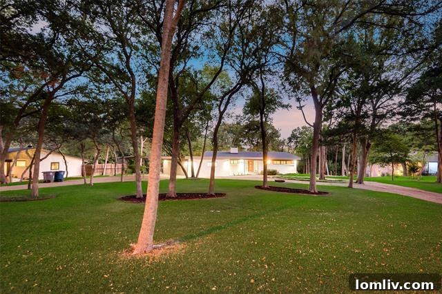 Lush creekside grounds surrounding the Mid-Century Modern property