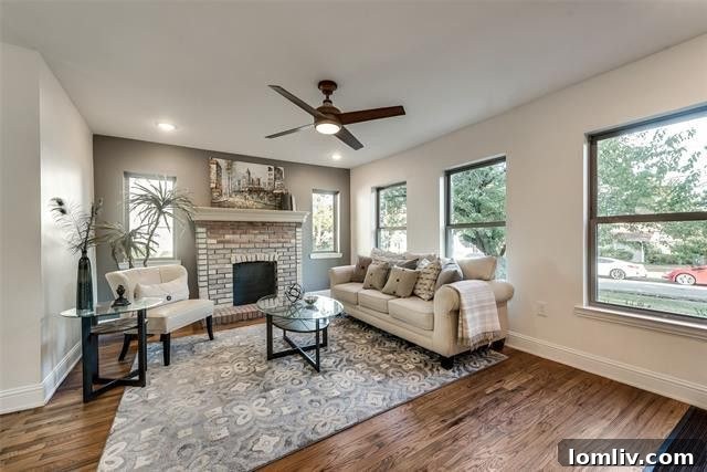 Inviting living room with hardwood floors in the Tudor home