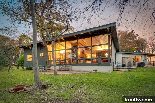 Mid-Century Modern exterior with expansive windows on Gladiolus Lane
