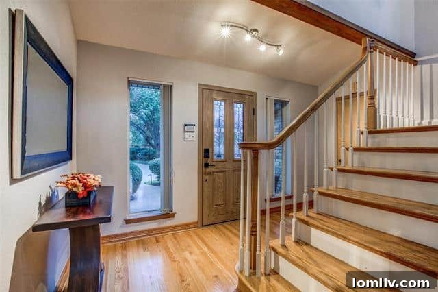 Expansive Living Room with Double-Height Stone Fireplace